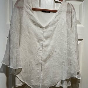 Beautiful white gooey shirt with tank top on the inside. Very comfortable